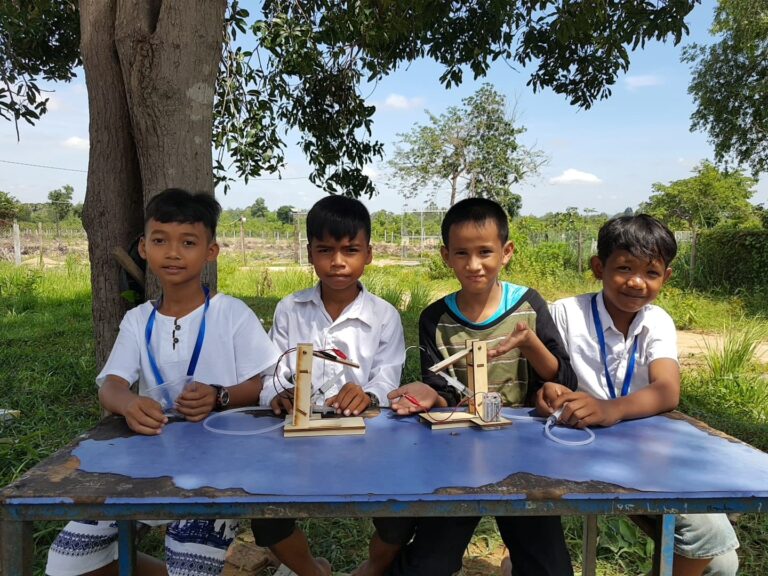 Kids practicing building hydro-system